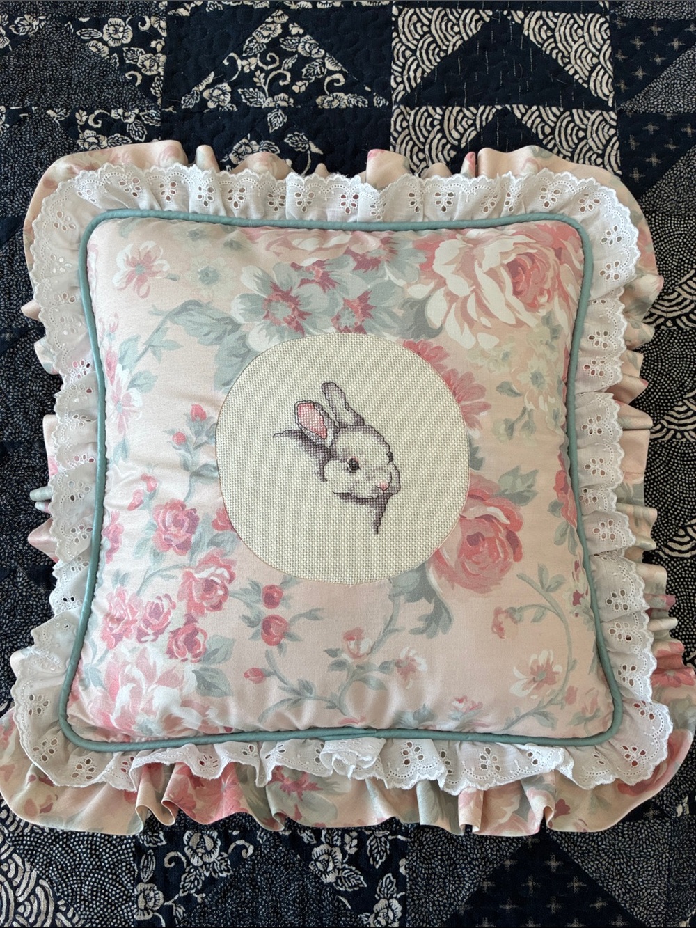 Hand-stitched cross stitch bunny pillow
